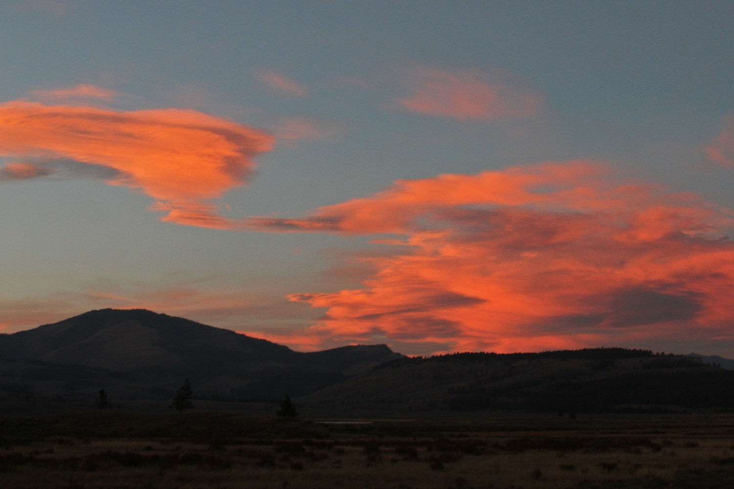 Sunset over Sepulcher Mountain, the sky banded with colour.